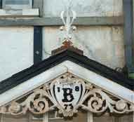 Attractive if decaying decoration on a house in Ethelbert Road.