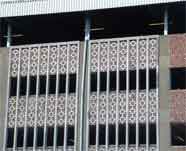 Attractive decoration does not really disguise Westmoreland Road car park and the more recent addition of the tin roof spoils the effect.